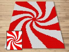 a red and white rug with an image of a candy cane