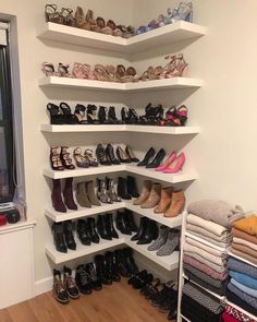 there are many pairs of shoes on the shelves