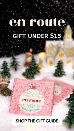 a christmas gift under $ 15 is on the cover of an e - book, surrounded by small trees and snow