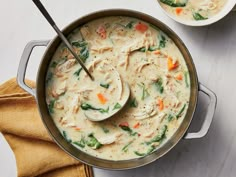 two bowls filled with soup on top of a table