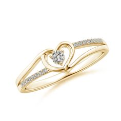 a yellow gold ring with a heart shaped diamond in the center and two diamonds on each band