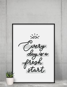 a black and white poster with the words every day is a fresh start on it