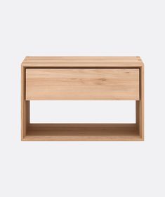 the side table is made out of wood and has two drawers on each side, one with