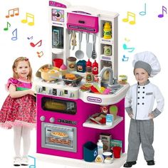 two children are standing in front of a play kitchen