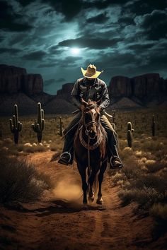 a man riding on the back of a brown horse across a dirt road under a full moon