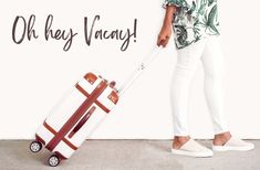 a woman standing next to a white wall with a red and brown suitcase on wheels