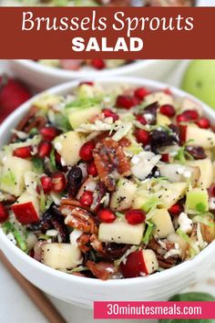 a salad with apples, celery, and nuts in it on top of a white plate