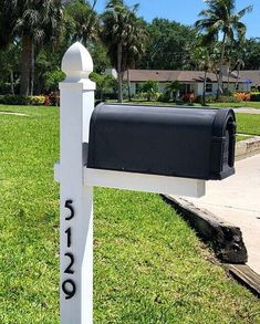 a mailbox is in the middle of a lawn