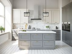 a kitchen with gray cabinets and white marble counter tops, along with an island in the middle