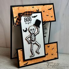 a halloween card with a skeleton holding a top hat on it's head and the words boo or you