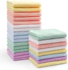 stack of multicolored towels on white background