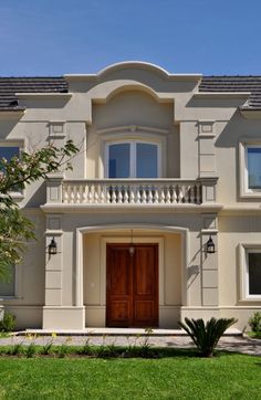 a large house with a brown front door