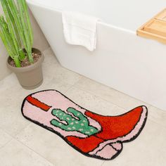 PRICES MAY VARY. 🌵PINK WESTERN DECOR - step into your bathroom and onto the range with our Cowboy Boot Bath Mat. Measuring a generous 33" x 20", this unique, irregular shaped rug features a vibrant pink, rust, and green cactus design that brings a touch of the wild west to your bathroom 🌵PREMIUM QUALITY - crafted from 100% polyester, this pink bath mat is not only soft and comfortable underfoot but also highly durable and easy to clean. The water-absorbent properties give your feet something c Funky Bathroom Rug, Cowboy Hat Rug, Pink Cowgirl Bathroom, Cowgirl Bathroom Decor, Disco Bathroom, Frog Bath Mat, Cowgirl Wall Decor, Cowgirl Bathroom, Cowboy Bathroom