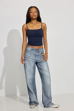 These baggy-fit jeans sit low on the hips and come with a bigger, full-length leg that bunches at the bottom. Perfect for your biggest sweater or your tiniest shirt. We're so in our bag rn. Features - Metallic silver paint effect - Five-pocket styling - Zip-fly with button closure Size & Fit - Fit: Relaxed - Rise: 11.5" - Inseam: 32" - Model is wearing size 3 Materials & Care - Content: 75% cotton, 25% organic cotton - Care: Wash cold, inside out - Imported New Academic Year, Low Rise Baggy Jeans, Garage Clothing, Holiday Wrap, Big Sweaters, College Outfit, Festival Shorts, Silver Paint, Mom Shorts