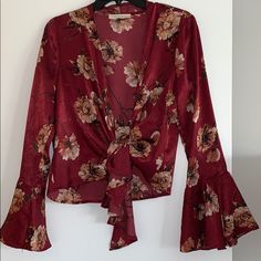 Red Silky Floral Blouse With Front Tie. Long Bell Shaped Sleeves. Never Worn- New Condition Red Blouse For Fall Brunch, Red Floral Print Blouse For Brunch, Burgundy Blouse For Spring Party, Red Floral Print Tops For Party, Red Floral Print Party Blouse, Red Bohemian Blouse For Brunch, Red Floral Blouse, American Threads, Floral Blouse