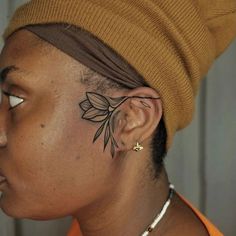 Back Of Both Elbows Tattoo, Color Tattoo Brown Skin, Face Tattoos For Black Women, Afro Pick Tattoo, Face Tattoo Black Women, Floral Face Tattoo, Afrocentric Tattoos For Women, Knew Tattoos, Black Woman Tattoo