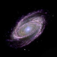 an image of a spiral galaxy in the night sky