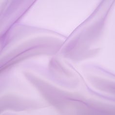 Sparks will fly when you lay your hands on this enchanted Lavender Satin-Faced Polyester Organza. Featuring a crisp drape, smooth hand, and lustrous face, it's ideal for ethereal evening wear.Suggested Projects:  Dresses, Skirts, Evening WearContent:  100% PolyesterStretch:  NoneOpacity:  SheerThe light purple satin face elevates the elegance that is tied to organza—a lightweight fabric lauded for bringing gorgeous volume to eveningwear. The crisp drape, smooth hand, and lustrous face work toget Light Purple Fabric, Fabric Texture Seamless, Mood Designer Fabrics, Mood Fabrics, Dress Forms, Purple Satin, Stunning Gowns, Purple Fabric, Dance Fashion