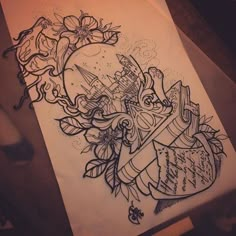 a drawing of a heart with flowers and an arrow in the middle is on top of a piece of paper