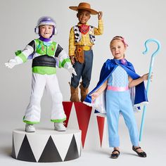 three children dressed up as toy story characters