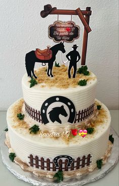 a three tiered cake decorated with horse and farmer's silhouettes on top