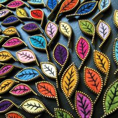 the colorful leather is decorated with leaves