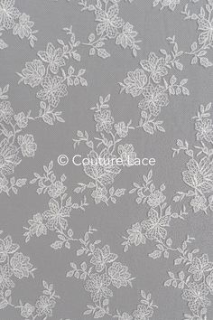 white lace with flowers on grey background