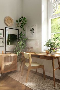 a living room filled with furniture next to a window and potted plant on top of a wooden table