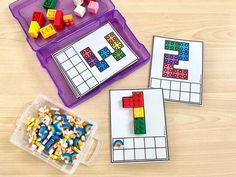 two plastic containers filled with legos next to each other on a wooden table top