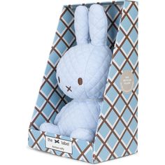 a blue stuffed rabbit in a box