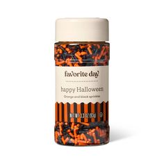 an orange and black sprinkles in a jar with the words happy halloween written on it