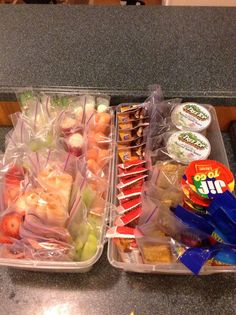 two plastic containers filled with food on top of a counter