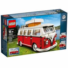 a red and white bus with a camper on the front is in a box