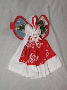 a red and white dress with snowflakes on it