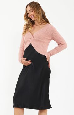 Made from a luxurious woven viscose satin, the Crystal Satin Maternity Skirt with its bias cut and semi-fitted silhouette ensure a graceful flow with every step. The fabric and the elastic band waist make this pull on skirt extremely comfortable to wear, and the shape is extremely flattering as it skims the hips and gently flares out to a flowing hem. It has movement whilst still giving shape, and doesn't cling. A piece that is easy to dress up or down for the office or the weekend, and can be t Skirt Pregnancy Outfit, Pregnant Wedding Guest Outfits, Maternity Evening Wear, Pregnant Party Dress, Maternity Two Piece, Maternity Evening, Maternity Lounge Wear, Black Satin Skirt, Maternity Dresses For Baby Shower