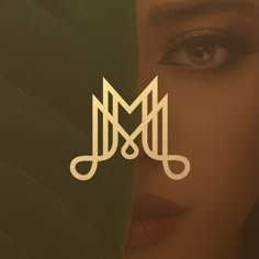 a woman's face with the letter m on it and an image of her eyes