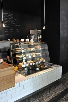 a bakery counter filled with lots of pastries