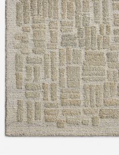 a beige rug with squares and rectangles on it