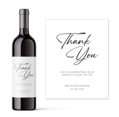 a bottle of wine next to a thank card