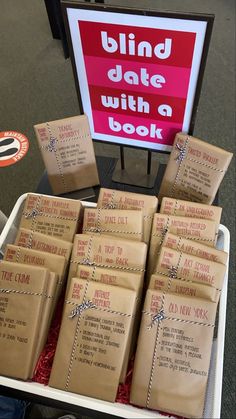 many packages of books are stacked on top of each other in front of a sign that reads blind date with a book