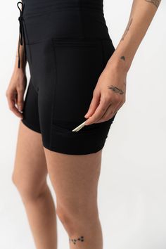 Three pockets, a perfect high-rise, and an elastic band for your glove... these shorts are ready for anything. This product is on Final Sale. Functional Black Bottoms With Built-in Shorts, Black Skort With Built-in Shorts, Black Sports Skort With Built-in Shorts, Sporty Knee-length Shorts For Outdoor Activities, Stretch Black Bottoms With Functional Pockets, Sports Shorts With Pockets, Knee-length, Black Stretch Bottoms With Functional Pockets, Functional Black Activewear With Hip Pockets, Outdoor Activity Solid Color Shorts