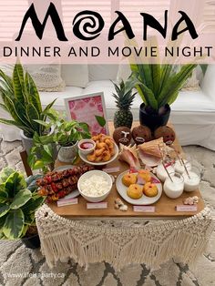 a table topped with lots of food and plants