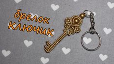 a key chain with a golden skeleton on it and the words spenok kahouk above it