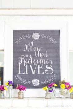 a chalkboard sign with flowers in vases on the mantle and below it is a quote that says show him that someone lives