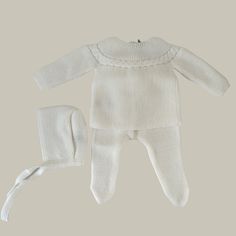 Reference: 1343-032/ 1343-050 Color: Ivory or White Materials: 100% acrylic Description: This unisex baby set is perfect for the first weeks of life. The sweater has buttons for fastening in the back. The footie has an elastic waistband. It comes with the matching bonnet. Intended Age: Newborn Boy Size Guide: As with most European brands, the Mebi sizing does come up small and we do recommend going up a size. Frankie’s Knit Set, Ribbed Newborn Outfit, White Knit Baby Sweater, Knit Baby Pants, White Baby Pajamas, Modern Knitting, Baby Set, Knit Set, Newborn Boy