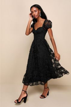 No matter the occasion, everyone will be curious about the identity of the beauty in the Lulus Notable Elegance Black Mesh Floral Applique Bustier Midi Dress! Lightweight mesh features a stunning pattern of 3D floral appliques as it shapes sheer puff sleeves with elastic at the cuffs and shoulders. Bodice has a sweetheart neckline with seamed cups and a high, fitted waist. A-line skirt falls to a tiered midi hem to complete the look. Hidden zipper/clasp at back. Fit: This garment fits true to size. Length: Mid-calf length. Size medium measures 46.5" from shoulder to hem. Bust: Great for any cup size. Waist: Fitted - very fitted at natural waist. Hip: Not Fitted - fuller skirt allows room for hips. Undergarments: May be worn with a strapless bra, adhesive bra, petals, or no bra. Fabric: Fab Dark Mori Fashion, Semi Formal Cocktail Dress, Cocktail Wedding Attire, Bustier Midi Dress, Dresses For Apple Shape, Fall Cocktail, Black Dresses Classy, Mori Fashion, Be Curious