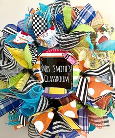 a colorful wreath with a sign that says mrs smith's classroom