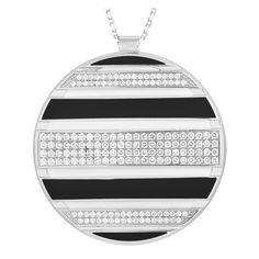 From Chaumet's Class One Collection, this necklace offers distinctiveness of form and elegance. It features an oversized disc pendant suspending from a white gold chain with a lobster clasp. The round pendant is detailed with horizontal black and white strips in enamel finish, and rows and rows of petite round diamonds.Offered in estate condition, this Chaumet Class One 18K White Gold 2.0ct Diamond Black and White Enameled Necklace is presented in a gift box. French Jewelry, Jewelry Workshop, White Gold Chains, Enamel Necklaces, White Gold Necklaces, Disc Pendant, Modern Necklaces, Black Necklace, Diamond Pendant Necklace