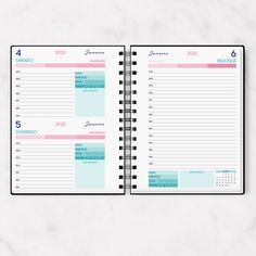 a planner is open on top of a marble surface