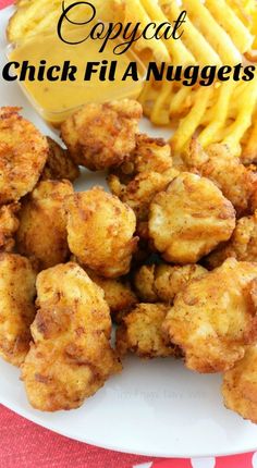 fried chicken nuggets and french fries on a plate with the words copycat